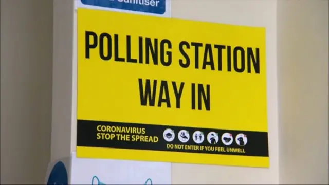 Polling station sign with coronavirus warnings