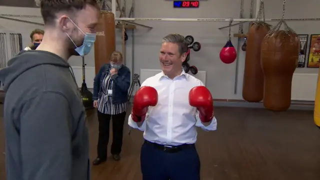 Sir Keir Starmer wearing boxing gloves on a campaign visit in Hull last week