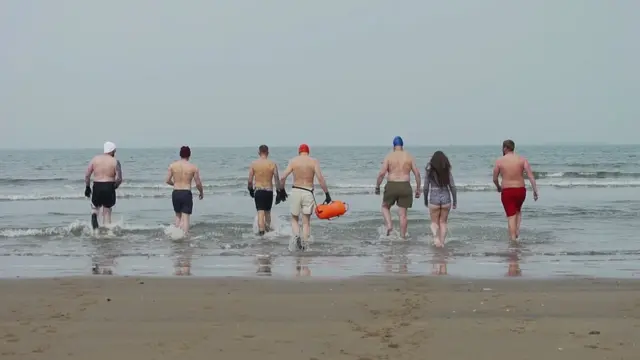 Swimmers head in to the sea in Hartlepool