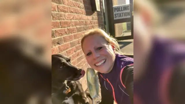 Brew Dog and his owner at a polling station