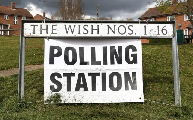 A polling station sign in Kenardington near Ashford in Kent, as people cast their votes