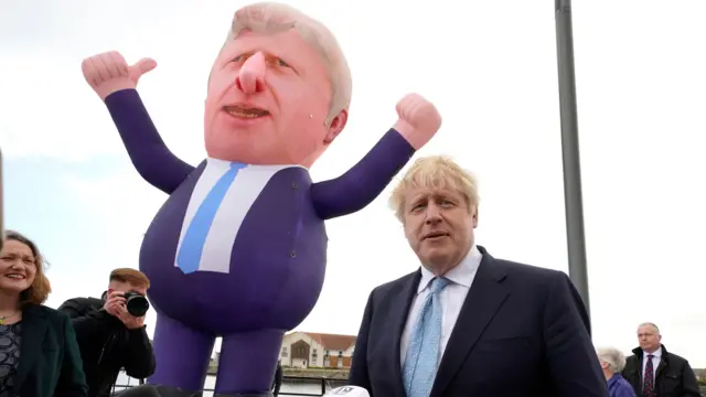 Boris Johnson poses with inflatable