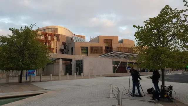 Cameras are trained on the Holyrood parliament