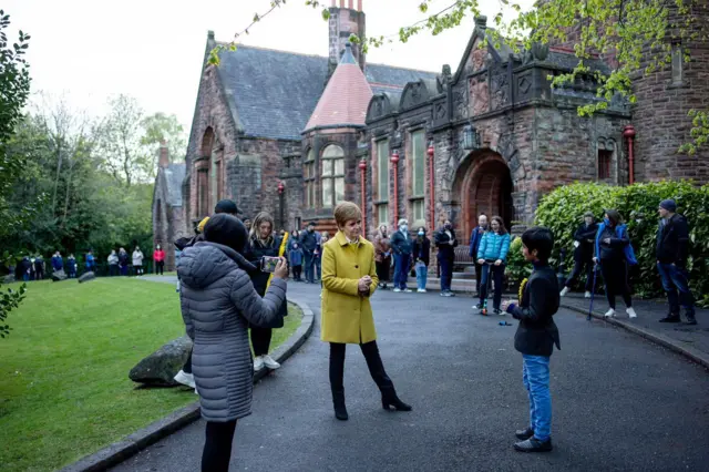 Nicola Sturgeon in front of queue to polling station