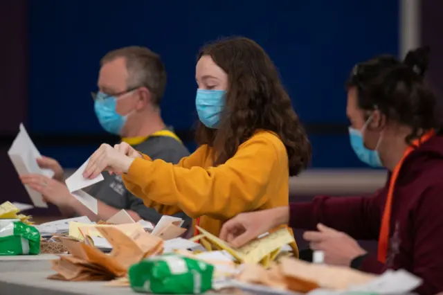 A woman counting votes in Cardiff