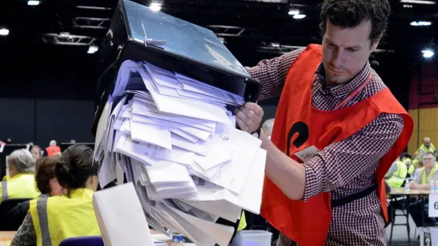 A ballot box is emptied