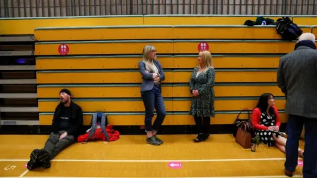 People wait as ballots are being counted at Mill House Leisure Centre, in Hartlepool