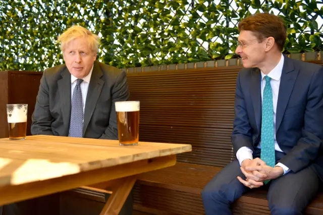 Prime Minister Boris Johnson shares a pint with Andy Street on the campaign trail