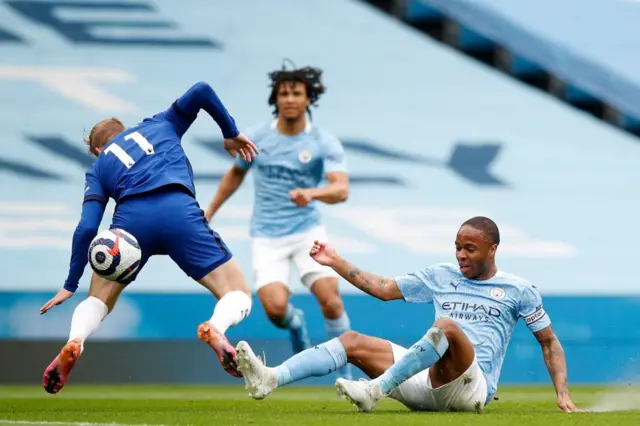 Raheem Sterling makes a challenge for Manchester City