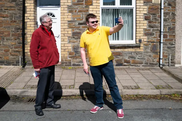 Mark Drakeford has his photo taken by a supporter