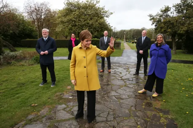 Scottish First Minister and SNP leader Nicola Sturgeon alongside newly elected MSPs during a visit to Airdrie