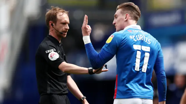 Ronan Curtis protests to the referee