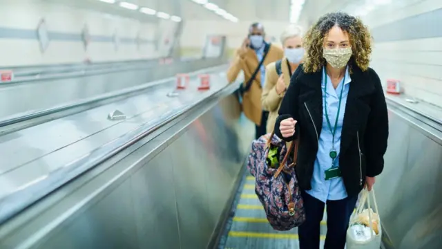 A woman wearing a face covering