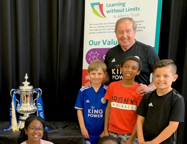 Heatherbrook Primary Academy pupils with FA cup and club ambassador Alan Birchnall