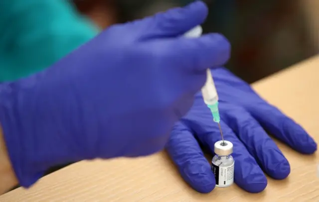 A vaccine dose being prepared