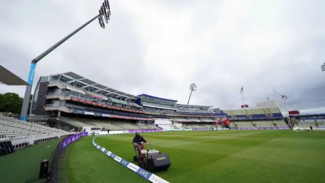 Ground staff prepare the outfield