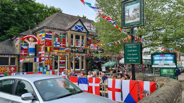 Flags outside the pub