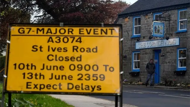 A sign warning of road closures and delays outside The Cornish Arms pub