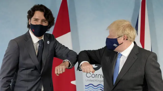 Justin Trudeau and Boris Johnson elbow bump