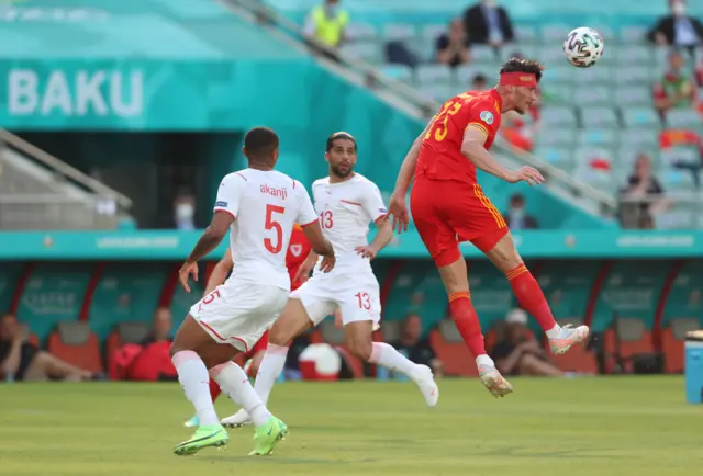 Kieffer Moore heads the ball