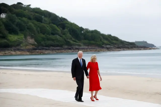 President Joe Biden and his wife Dr jill Biden on the beach in Carbis Bay