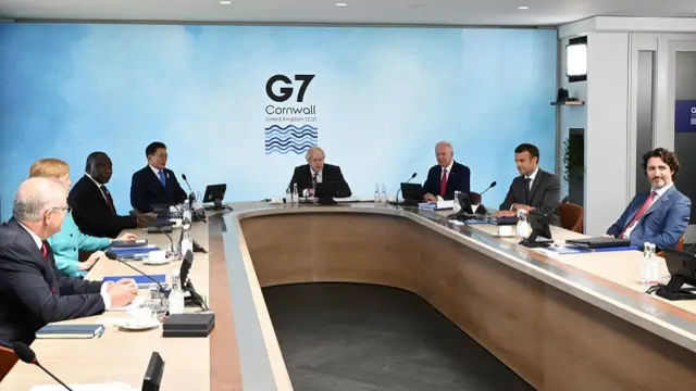 British Prime Minister Boris Johnson, U.S. President Joe Biden, France"s President Emmanuel Macron, Canadian Prime Minister Justin Trudeau, Australia"s Prime Minister Scott Morrison, German Chancellor Angela Merkel, South Africa"s President Cyril Ramaphosa and South Korea"s President Moon Jae-in attend a working session during G7 summit in Carbis Bay,