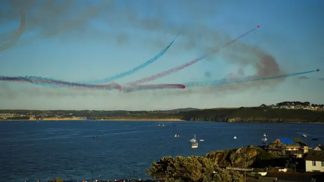 The Royal Air Force aerobatic team, the Red Arrows, perform over St Ives, during the G7 summit in Cornwall, Britain,