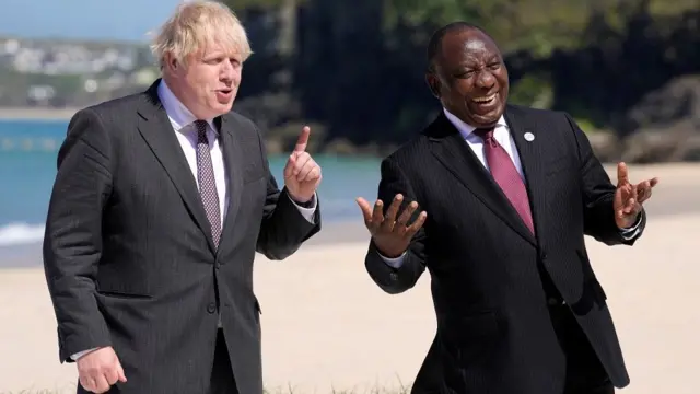 South Africa"s President Cyril Ramaphosa laughs as Britain"s Prime Minister Boris Johnson gestures during the G7 summit in Carbis Bay, Cornwall, Britain