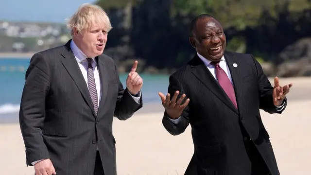 British Prime Minister Boris Johnson (L) welcomes South Africa"s President Cyril Ramaphosa during the G7 Summit in Carbis Bay, Britain,