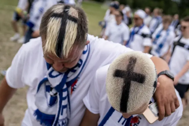 Finland fans show off crosses in bleached hair