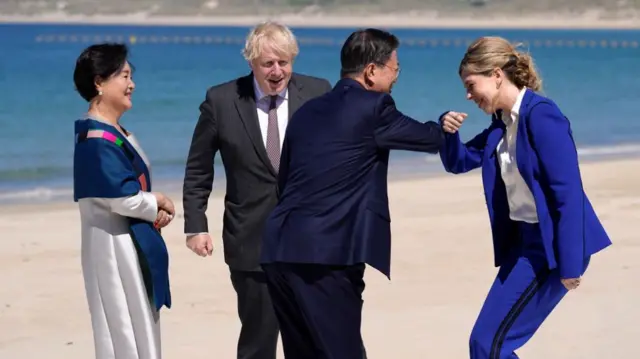 Britain"s Prime Minister Boris Johnson and his spouse Carrie Johnson greet South Korea"s President Moon Jae-in and first lady Kim Jung-sook, during the G7 summit in Carbis Bay, Cornwall,