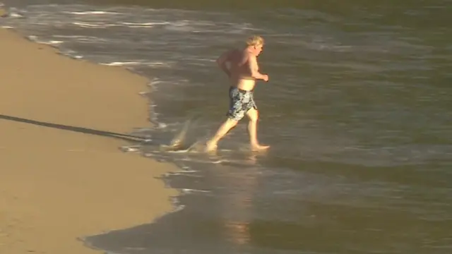 Boris Johnson takes a dip in the sea during the G7 summit