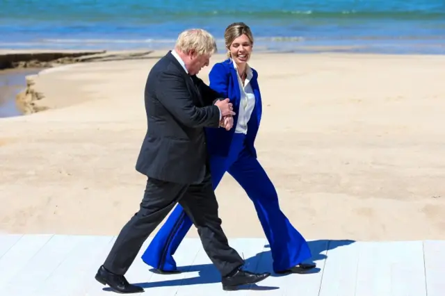 Prime Minister Boris Johnson and his wife Carrie arrive to greet attendees during the G7 Summit in Carbis Bay