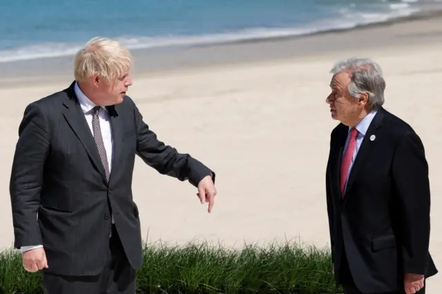 Boris Johnson talks to United Nations Secretary General Antonio Guterres during the G7 summit