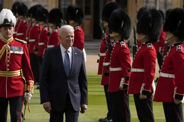 US President Joe Biden inspects a Guard of Honour during a visit to Windsor Castle in Berkshire to meet Queen Elizabeth II.