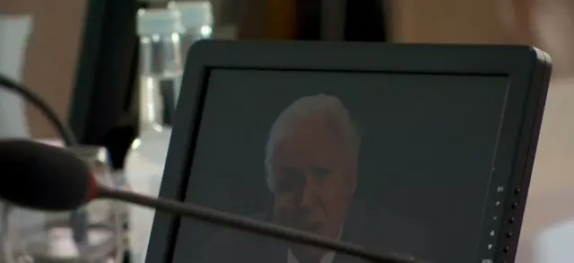 David Attenborough seen on the screen of one of the G7 leaders