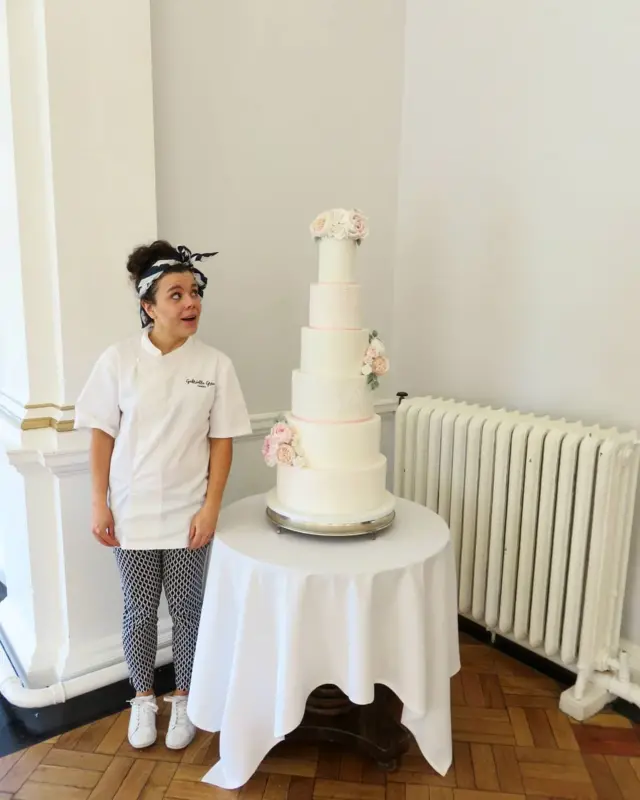 Gabriella Grace and one of her wedding cakes