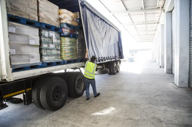 Stock image of HGV being unloaded