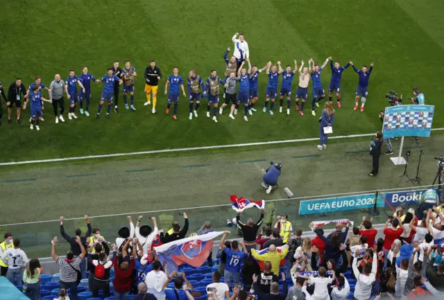 Slovakia players celebrating in front of their fans at full time