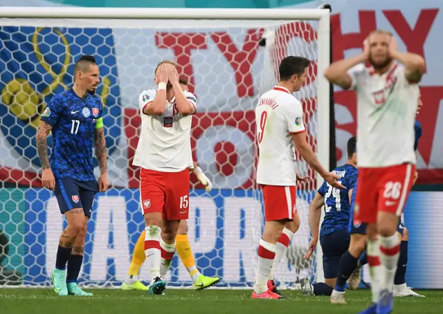 Poland players with their heads in their hands