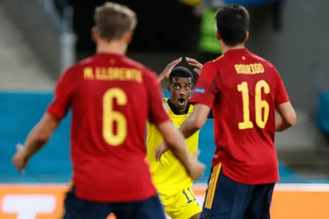 Alexander Isak reacts after his shot hit the post