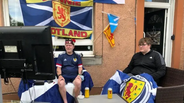 Robert McBrierty spent two hours turning his front garden into his own beer garden to watch the game with his grandson in the Saughton area of Edinburgh