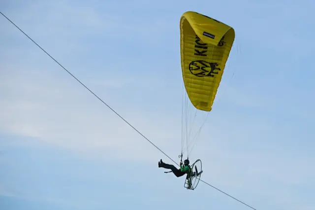 An activist landing on the pitch before kick-off