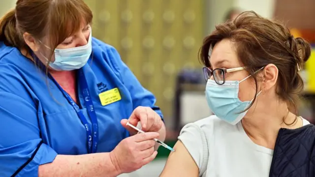 Person receiving a vaccination