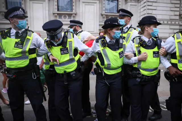 Police at Downing Street anti-lockdown protest