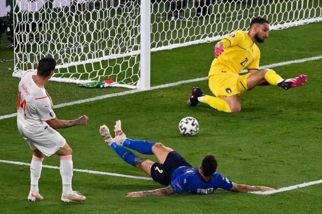 Italian keeper making his first save of the match