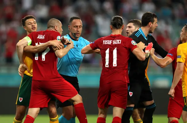 Wales & Turkey players clash