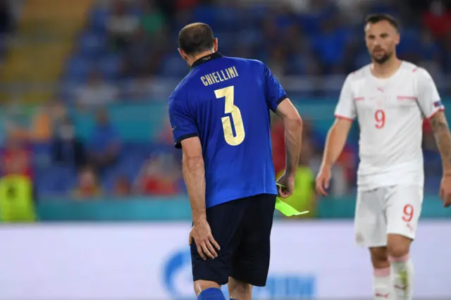 Chiellini holding his injured hamstring