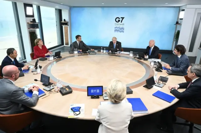 G7 leaders sit around the table at the top of the G7 meeting