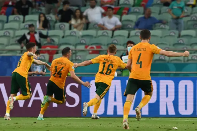 Wales celebrate Connor Roberts' goal